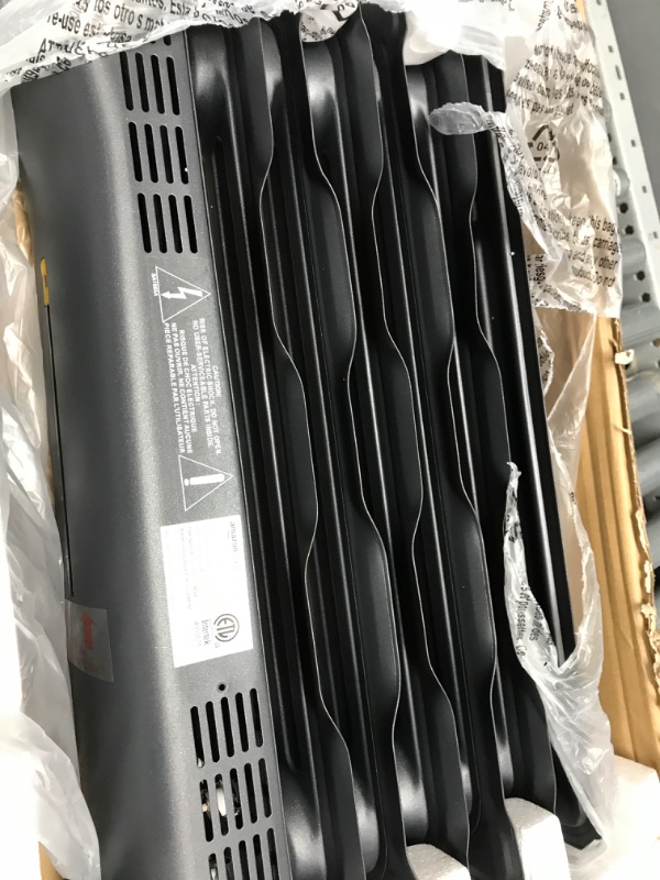 Photo 3 of Amazon Basics Portable Radiator Heater with 7 Wavy Fins, Manual Control, Black, 1500W