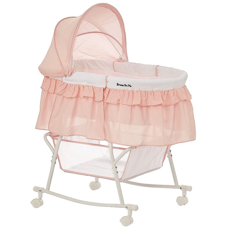 Photo 1 of Dream On Me Lacy Portable 2-in-1 Bassinet & Cradle in Rose Quartz, Lightweight Baby Bassinet with Storage Basket, Adjustable and Removable Canopy
