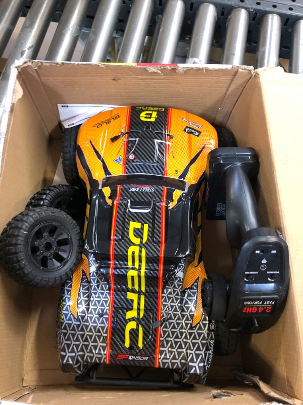 Photo 1 of DEERC 9201E 1:10 Large Remote Control Truck with Lights, Fast Short Course RC Car, 48 km/h 4x4 Off-Road Hobby Grade Toy Monster Crawler Electric Vehicle with 2 Rechargeable Batteries for Adult Kid Boy
