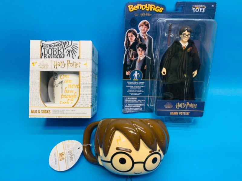 Photo 1 of 222590…3 piece- Harry Potter mugs, socks, and figure