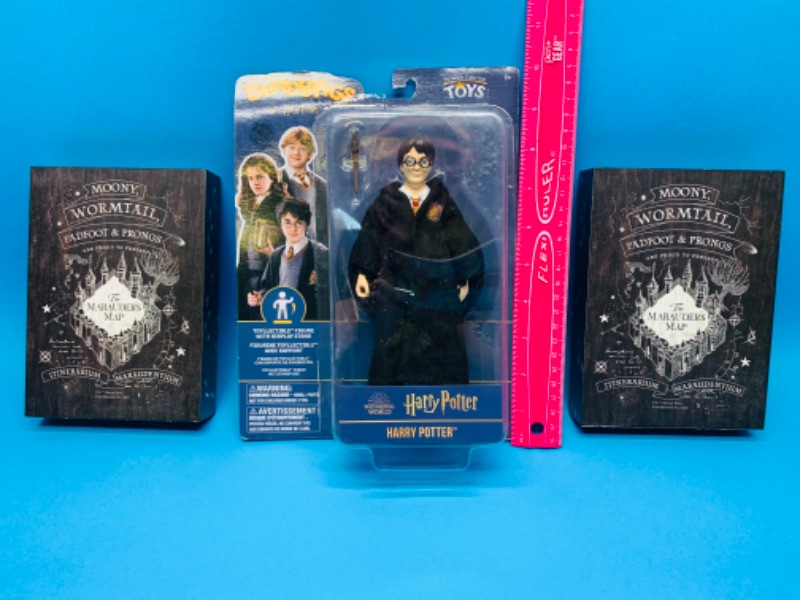 Photo 1 of 222637… Harry Potter figure and 2 wizarding world signs 