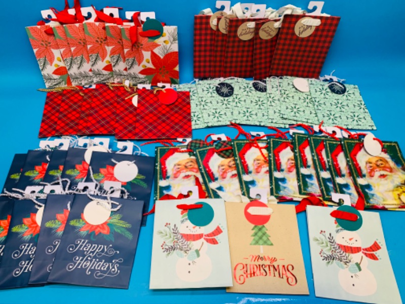 Photo 1 of 223303…43 small  Christmas gift bags 