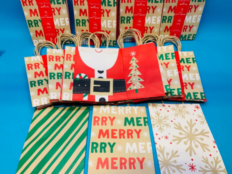 Photo 1 of 223353…50 holiday gift bags 6 x 4 x 8”