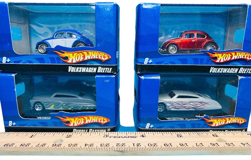 Photo 1 of 223950…4 small die cast cars in display cases 