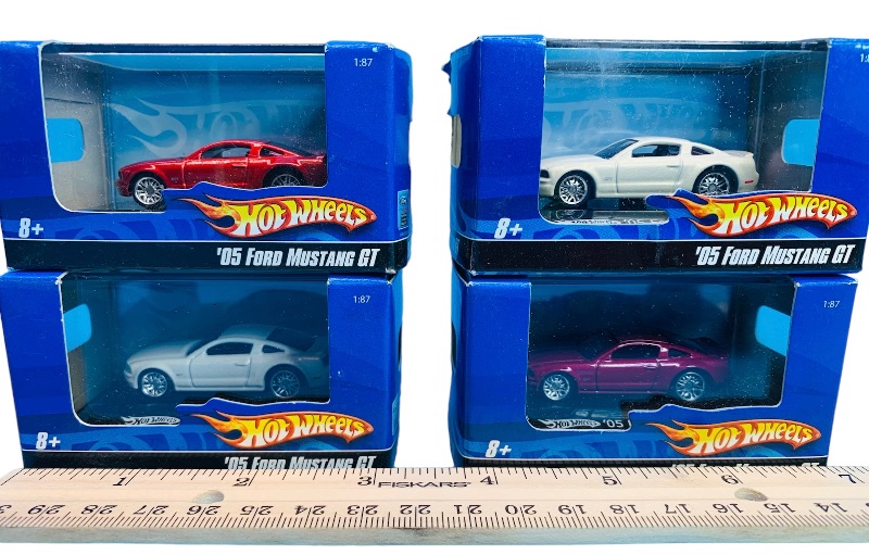 Photo 2 of 223951… 4 small die cast ford Mustang cars in display cases 