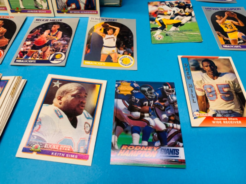 Photo 4 of 223989….2000+  Miscellaneous basketball and football trading cards in large box see photos 