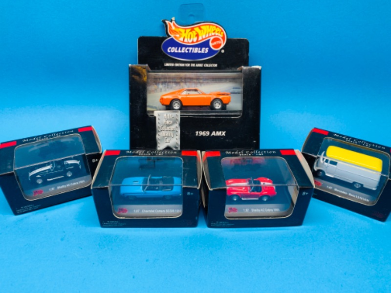 Photo 1 of 224469…5 collectible die cast cars in display cases 