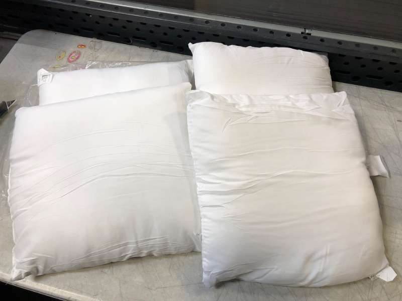 Photo 1 of 4 COUNT SMALL 12X12 PILLOWS
USED
NEEDS WASH
