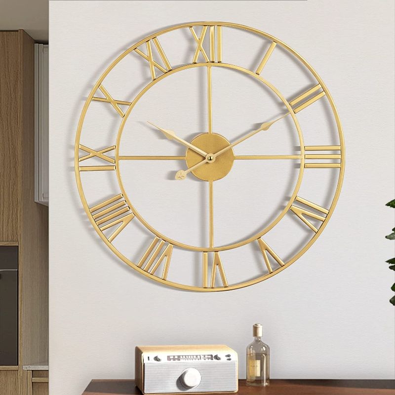 Photo 1 of 1st owned Large Wall Clock Metal Retro Roman Numeral Clock, Modern Round Wall Clocks Almost Silent , Easy to Read for Living Room/Home/Kitchen/Bedroom/Office/School Decor (Gold, 24 Inch)
