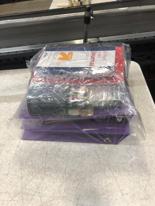 Photo 1 of 29 Item- Stationary Bundle. 17 Red Notebooks, 4 Pink Notebooks, 2 Binders, 2 Staples, Magnetic Mesh Cup, 2 Mechanical Pencils, College Ruled Journal