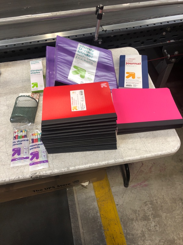 Photo 2 of 29 Item- Stationary Bundle. 17 Red Notebooks, 4 Pink Notebooks, 2 Binders, 2 Staples, Magnetic Mesh Cup, 2 Mechanical Pencils, College Ruled Journal