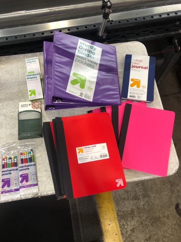 Photo 1 of 29 Item- Stationary Bundle. 17 Red Notebooks, 4 Pink Notebooks, 2 Binders, 2 Staples, Magnetic Mesh Cup, 2 Mechanical Pencils, College Ruled Journal