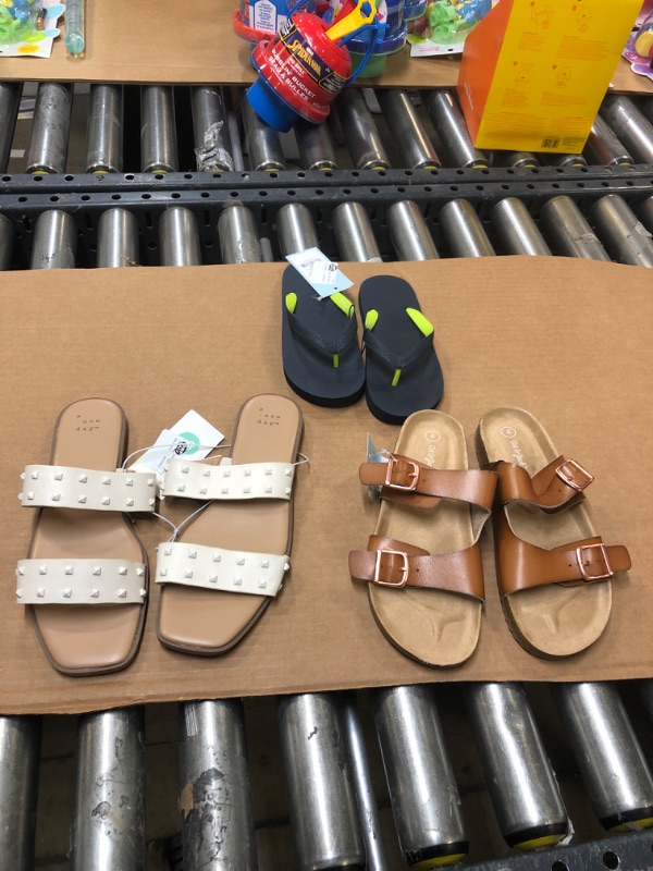 Photo 1 of 3 Pairs of sandals all different sizes
