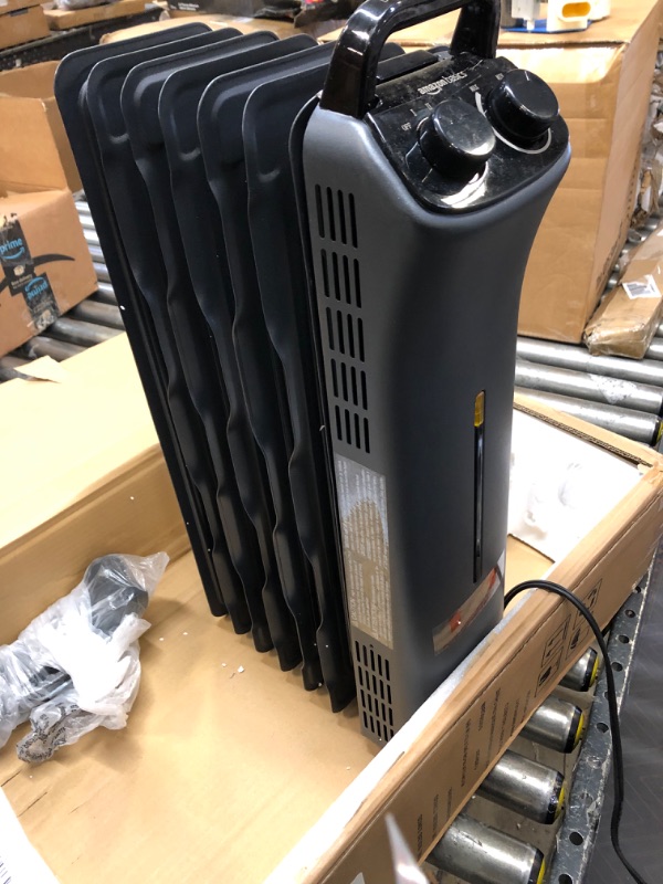 Photo 3 of Amazon Basics Portable Radiator Heater with 7 Wavy Fins, Manual Control, Black, 1500W