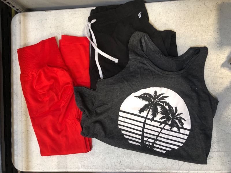 Photo 1 of 3pc WOMENS ATHLETIC CLOTHES BUNDLE: 1 tank top size medium; 1 soffe low-rise black pants size small; 1 red leggings no size
