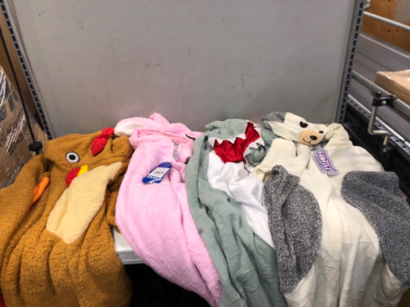 Photo 1 of 4 COUNT OF ADULT ONESIES ( VARIOUS SIZES ) ( ONESIES ARE DIRTY ) 
