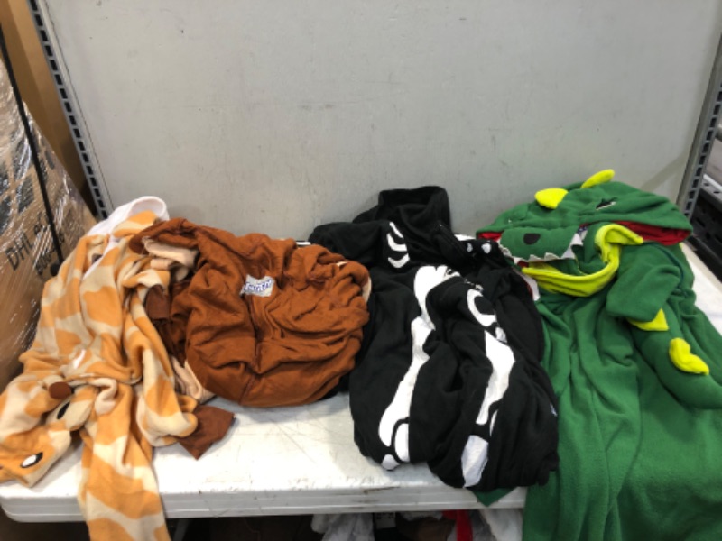 Photo 1 of 4 COUNT OF ADULT ONESIES ( VARIOUS SIZES ) ( ONESIES ARE DIRTY ) 