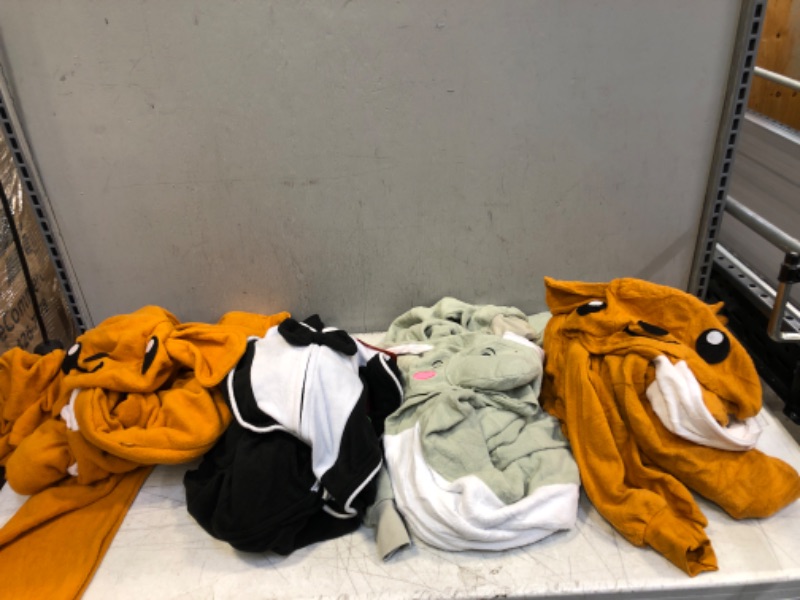 Photo 1 of 4 COUNT OF ADULT ONESIES ( VARIOUS SIZES ) ( ONESIES ARE DIRTY ) 