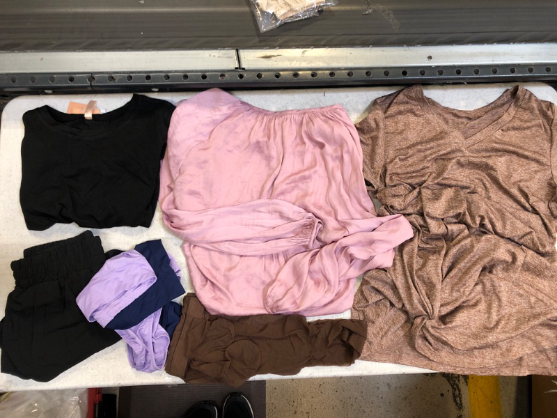 Photo 1 of 7-piece WOMENS CLOTHING BUNDLE: 1 pink longsleeve top unknown size; 1 black short size small; 1 black shirt size small; 1 short sleeve tshirt medium; brown sheer pantyhose no size; 2 pair large size panties 