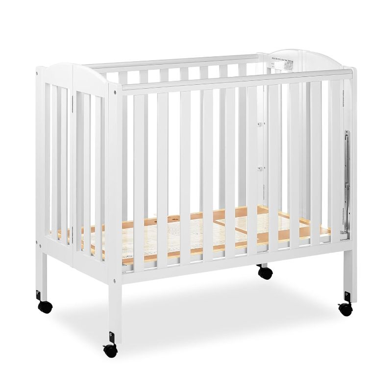 Photo 1 of Dream On Me 3 in 1 Portable Folding Stationary Side Crib in White, Greenguard Gold Certified, Safety Wheel with Locking Casters, Convertible, 3 Mattress Heights
