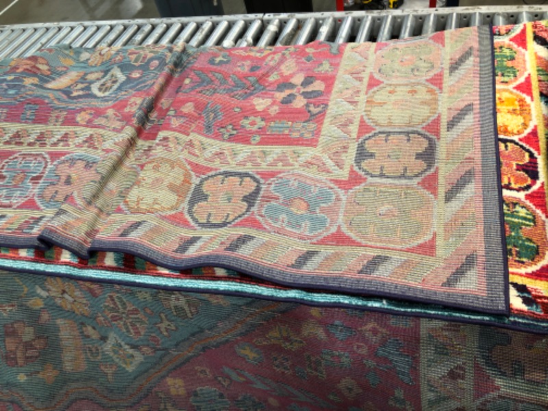 Photo 1 of Multi color rug 10’ x 14’