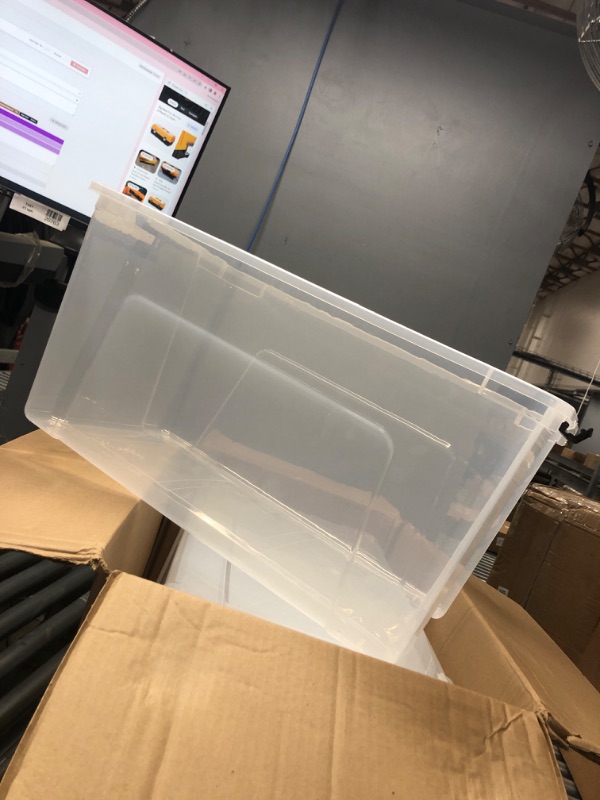 Photo 1 of 4 large clear storage bins 