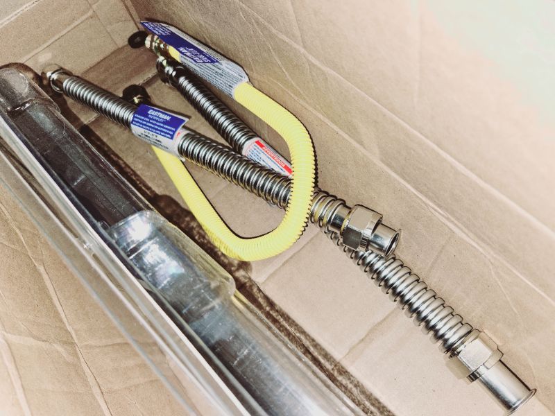 Photo 2 of (LOOSE HARDWARE) Eastman Gas Water Heater Installation Kit, 18 Inch Corrugated Stainless Steel Water Heater Hoses, 24 Inch Yellow Gas Supply Connector, 48280