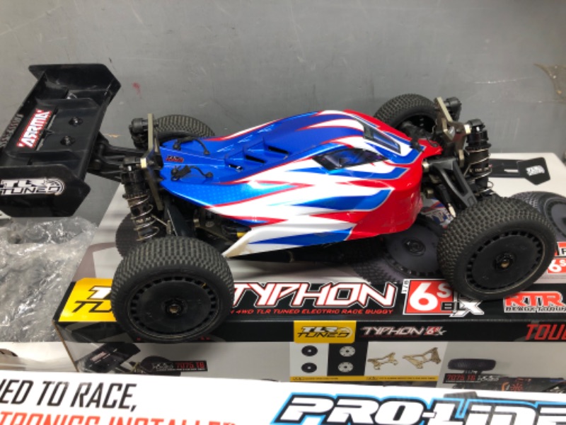 Photo 4 of ************UNKNOWN IF COMPLETE********************
ARRMA RC Car 1/8 TLR Tuned Typhon 6S 4WD BLX Buggy RTR (Battery and Charger Not Included), Red/Blue, ARA8406, Cars, Electric Kit Other