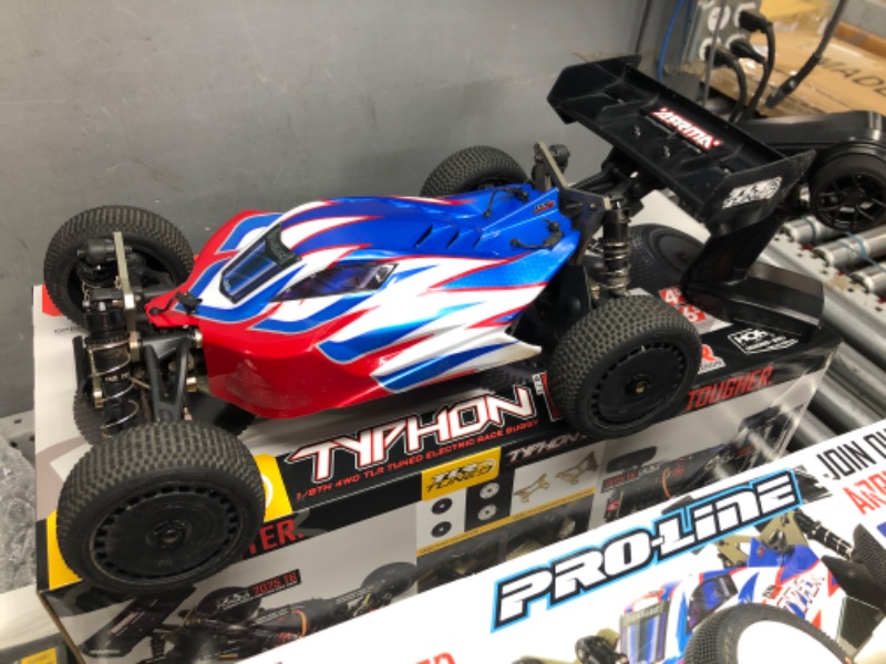 Photo 2 of ************UNKNOWN IF COMPLETE********************
ARRMA RC Car 1/8 TLR Tuned Typhon 6S 4WD BLX Buggy RTR (Battery and Charger Not Included), Red/Blue, ARA8406, Cars, Electric Kit Other