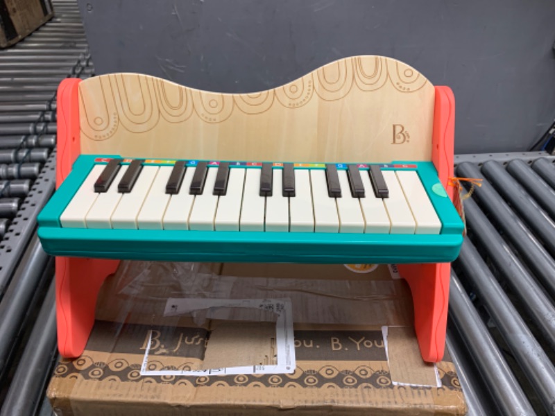 Photo 2 of B. toys wooden toy piano with songbook, piano wooden toy, music toy, musical instrument to learn to play the piano for children from 3 years old.