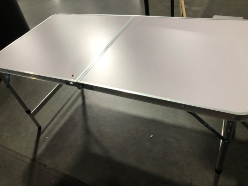 Photo 3 of **MAJOR DAMAGE**
Moosinily Folding Camping Table, 4 Ft Aluminum Folding Table, Pink