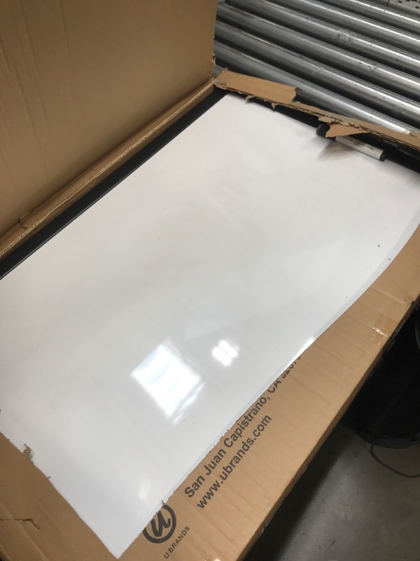 Photo 1 of black frame 23x35 magnetic dry erase board with marker 