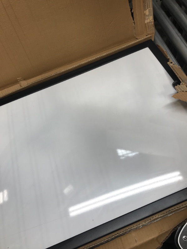 Photo 1 of black frame 23x35 magnetic dry erase board with marker 