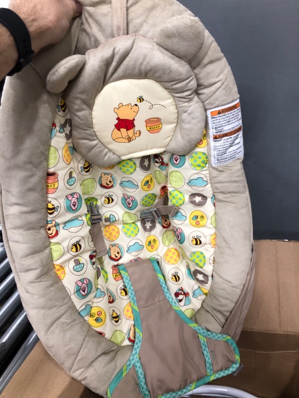 Photo 2 of Bright Starts Disney Baby Winnie the Pooh Baby Bouncer Soothing Vibrations Deluxe Infant Seat - Faux Suede, Music, Removable -Toy Bar, 0-6 Months 6-20 lbs (Dots & Hunny Pots)
