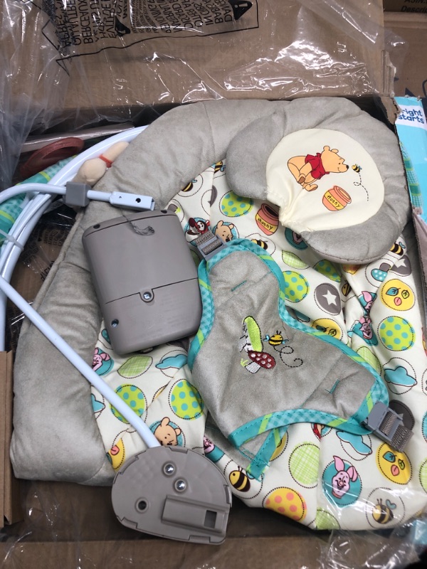 Photo 2 of Bright Starts Winnie the Pooh Dots & Hunny Pots Baby Bouncer with Vibrating Infant Seat, Music & 3 Playtime Toys, 23x19x23 Inch