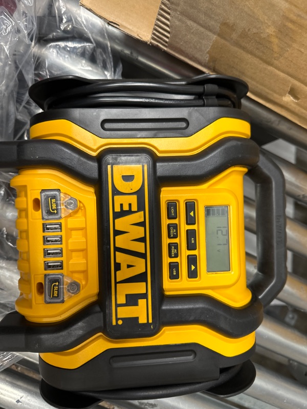 Photo 1 of DEWALT DXAEPS14 1600 Peak Battery Amp 12V Automotive Jump Starter/Power Station with 500 Watt AC Power Inverter, 120 PSI Digital Compressor, and USB Power , Yellow
