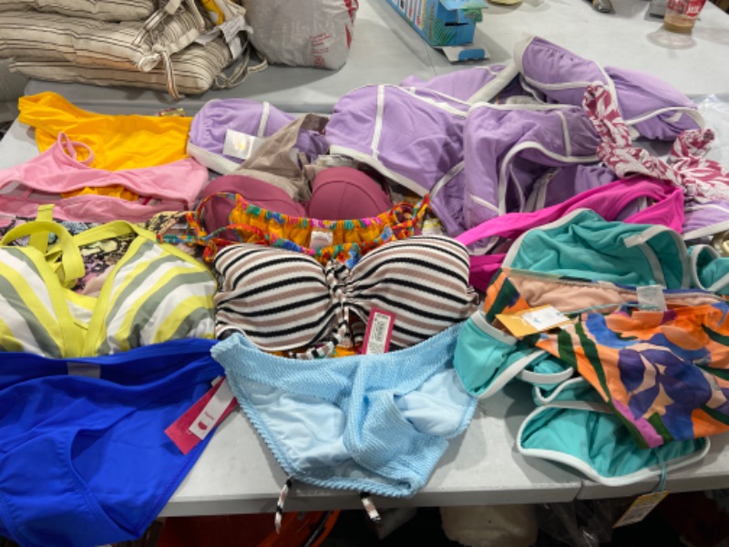 Photo 2 of BOX LOT OF DIFFERENT SIZE SWIMSUITS 