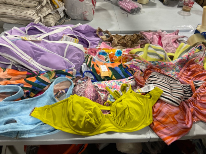 Photo 2 of BOX LOT OF DIFFERENT SIZE SWIMSUITS 