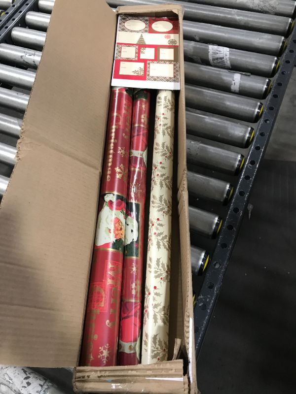 Photo 2 of Hallmark Reversible Christmas Wrapping Paper Set with Ribbon and Gift Tag Stickers (Traditional Red and Gold, 3 Rolls of Wrapping Paper and Ribbon)