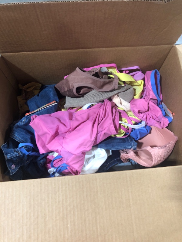 Photo 1 of BOX OF MISC CLOTHING OF VARIOUS STYLES COLORS AND SIZES SOLD AS IS