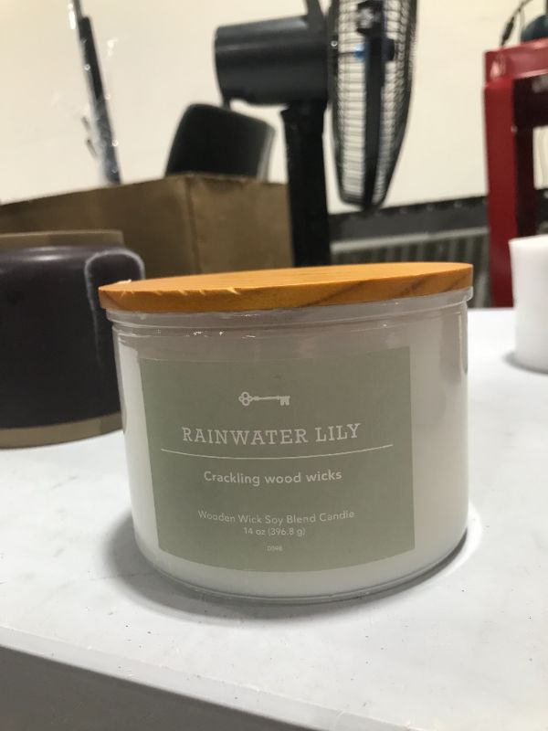 Photo 2 of 3-Wick Milky White Glass Woodwick Candle with Wood Lid and Stamped Logo Rainwater Lily - Threshold™
