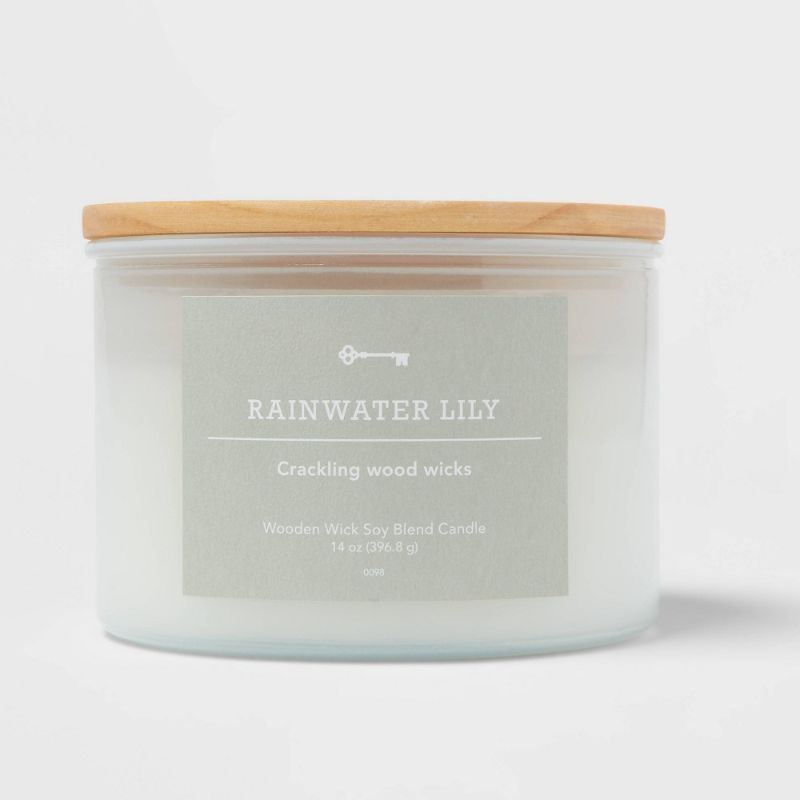 Photo 1 of 3-Wick Milky White Glass Woodwick Candle with Wood Lid and Stamped Logo Rainwater Lily - Threshold™
