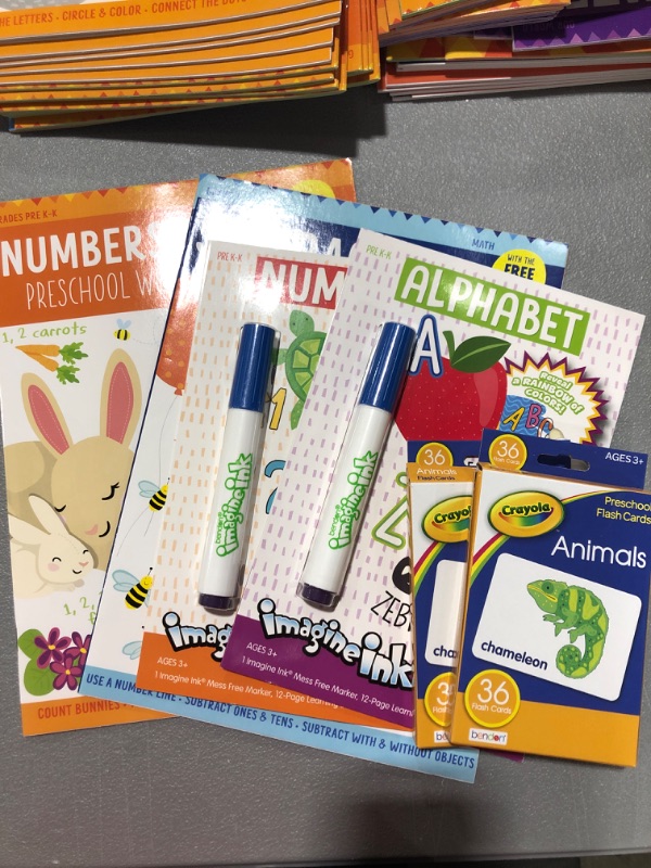 Photo 1 of 2 ImagineInk books, 2 workbooks, and 2 packs of various flashcards for kids