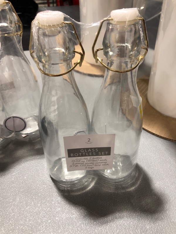 Photo 1 of 2 sets of 2 glass bottles (4 total)