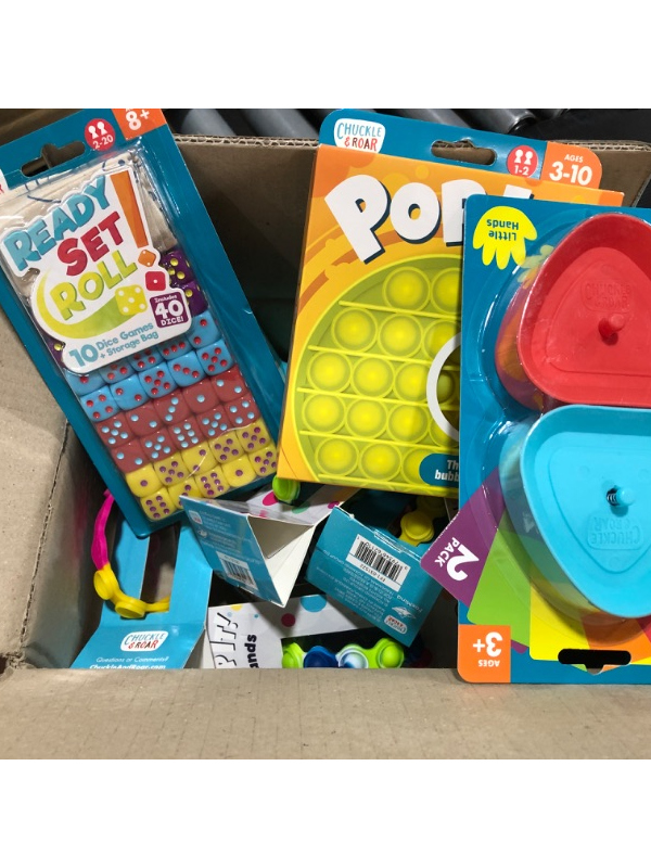 Photo 1 of A box lot of pop its and activities. 