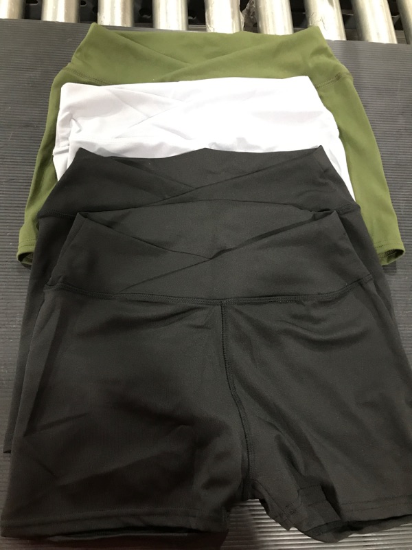 Photo 1 of 4 pack of exercise shorts- size M- Olive green,2 black,and 1 gray