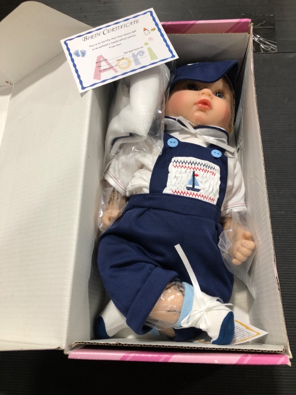 Photo 2 of Aori Reborn Baby Dolls 22 Inch Realistic Newborn Baby Boys Lifelike Weighted Reborn Dolls Cool Princekin with Blue Suspender Suit and Wooden Toys Great Birthday Set for Boys Age 3+
