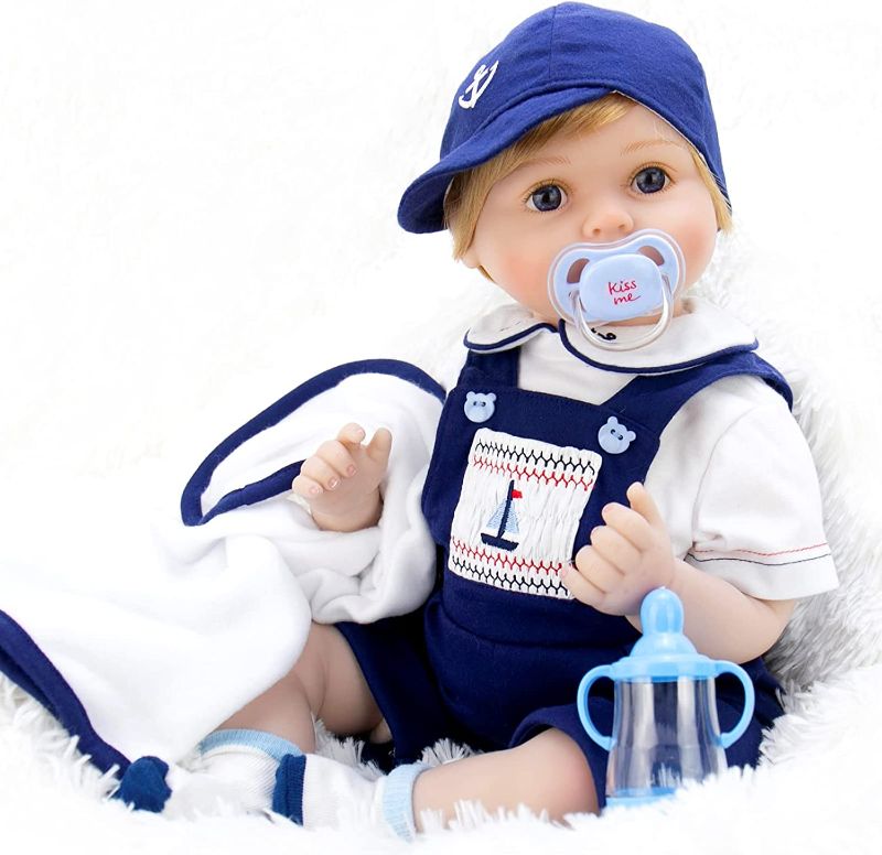 Photo 1 of Aori Reborn Baby Dolls 22 Inch Realistic Newborn Baby Boys Lifelike Weighted Reborn Dolls Cool Princekin with Blue Suspender Suit and Wooden Toys Great Birthday Set for Boys Age 3+
