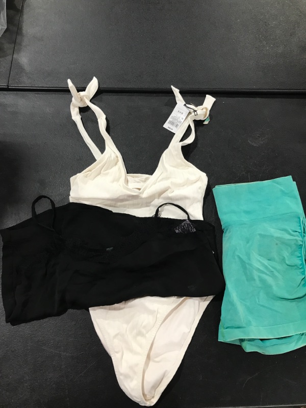 Photo 1 of A lot box of miscellanous women's clothing. swimsuit; Medium-- Black shirt: Small --shorts : Large 