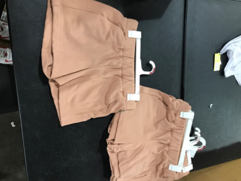 Photo 1 of A BOX LOT OF WOMENS TAN SHORTS. CONTAINS 6 PAIRS SIZES ARE XSMALL